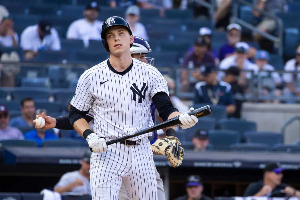 Ben Rice, versatile Yankees catcher and first baseman, taking practice swings in the batting cage for Triple-A Scranton/Wilkes-Barre. At 25, Rice has demonstrated offensive potential, hitting seven home runs in his MLB career, though recent struggles in the minors have dampened some of his momentum. Fans are eager for him to step up in the Yankees' push for the postseason.