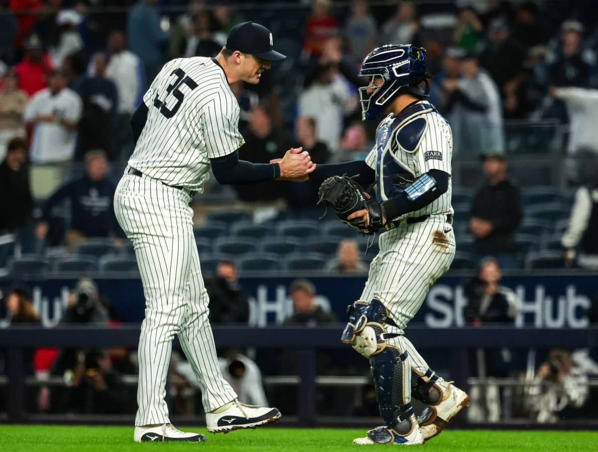 Yankees' Clay Holmes and Jose Trevino celebrate the successful ninth inning against the Pirates on Sept. 39, 2024.