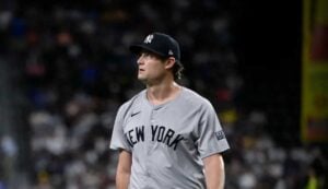 Yankees starting pitcher Gerrit Cole (45) walks off the field after he pitches against the Texas Rangers during the first inning at Globe Life Field.