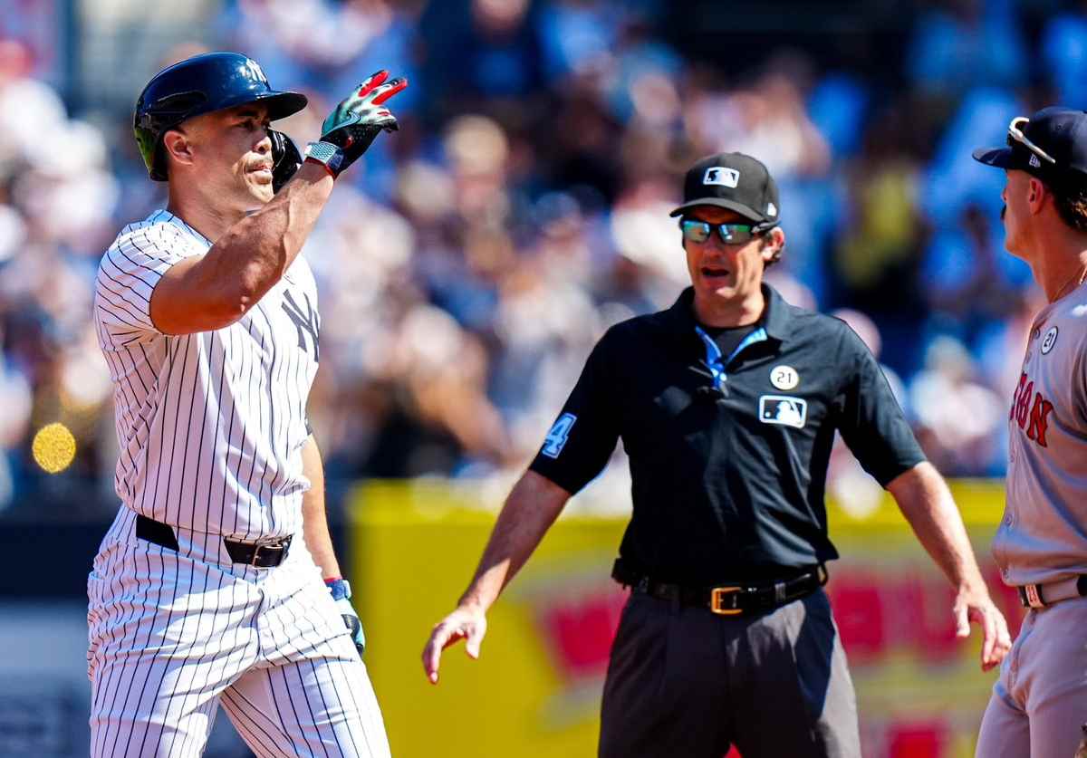 On Sunday, Sept. 15, 2024, Giancarlo Stanton swings powerfully at the plate, driving in two key runs with a double during the Yankees' 5-2 victory over the Red Sox