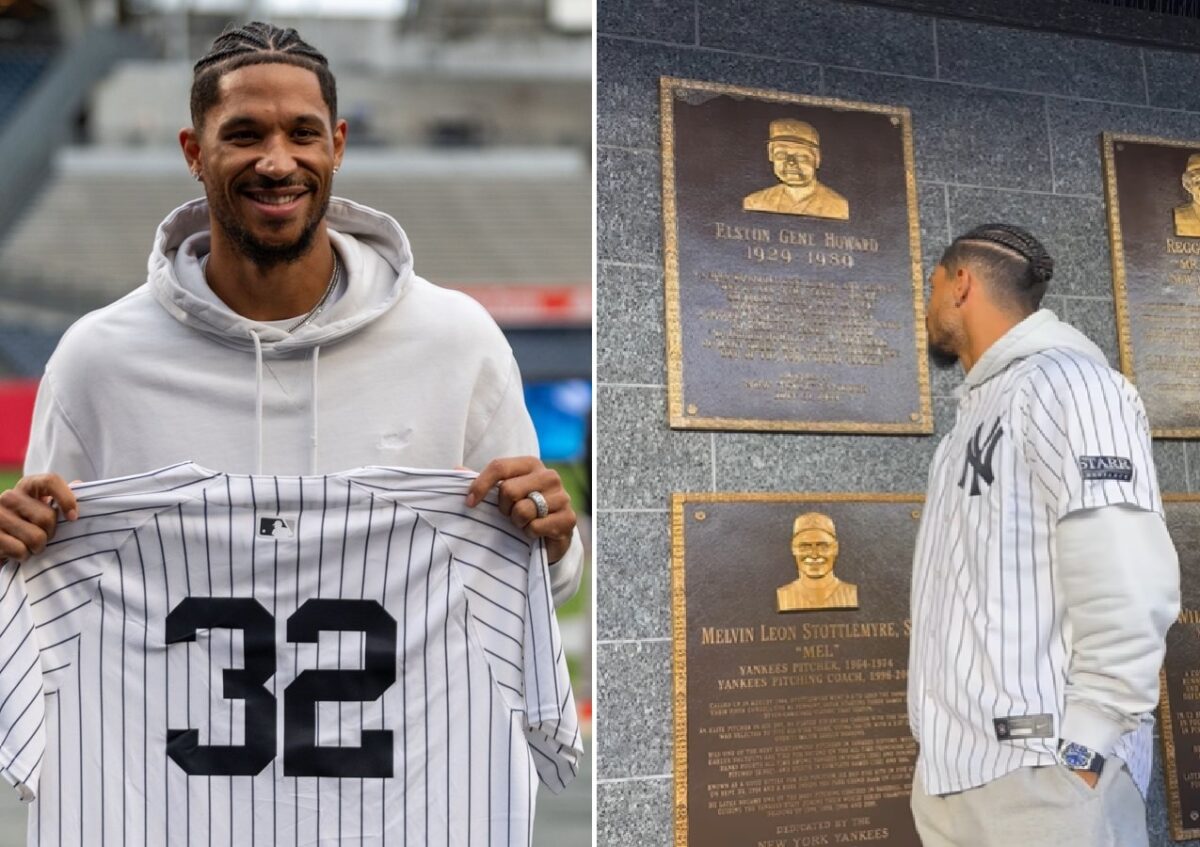 Knicks star Josh Hart with the jersey of his great uncle and Yankees icon Elston Howard and watching Howard's plaque at Monument Park on Sept. 24, 2024.