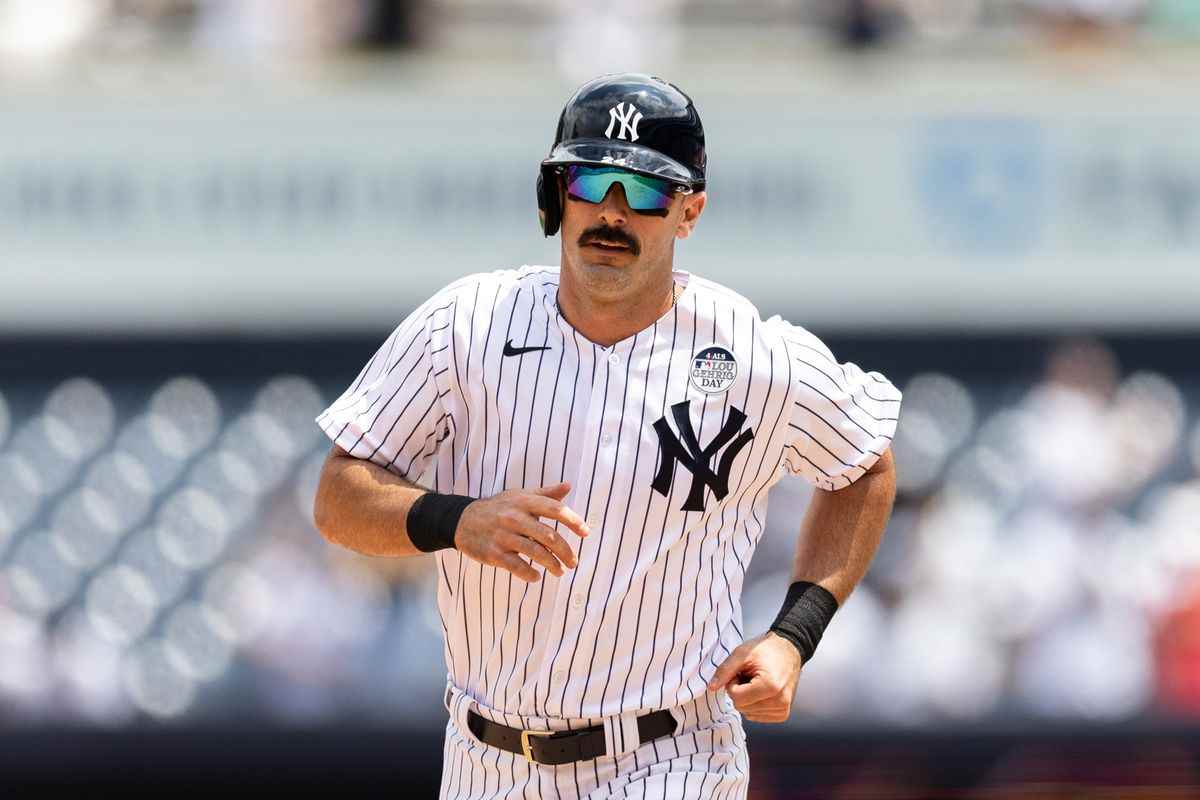 Matt Carpenter, wearing his Yankees jersey, stands poised at the plate during a 2022 game, delivering one of his standout performances that endeared him to fans in the Bronx.