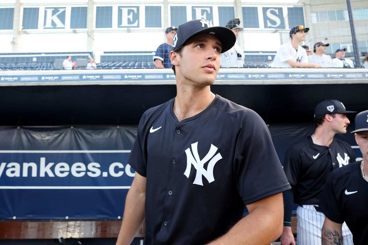 Spencer Jones, in a close-up shot, stands ready at the plate during a minor league game