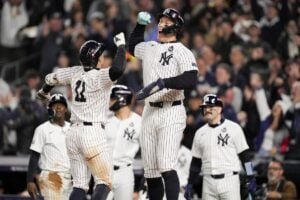 New York Yankees’ Anthony Volpe celebrates his grand slam home run with Aaron Judge against the Los Angeles Dodgers during the third inning in Game 4 of the baseball World Series, Tuesday, Oct. 29, 2024, in New York.