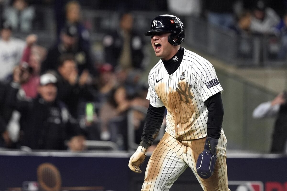 New York Yankees’ Anthony Volpe reacts after scoring against the Los Angeles Dodgers during the eighth inning in Game 4 of the baseball World Series, Tuesday, Oct. 29, 2024, in New York. 