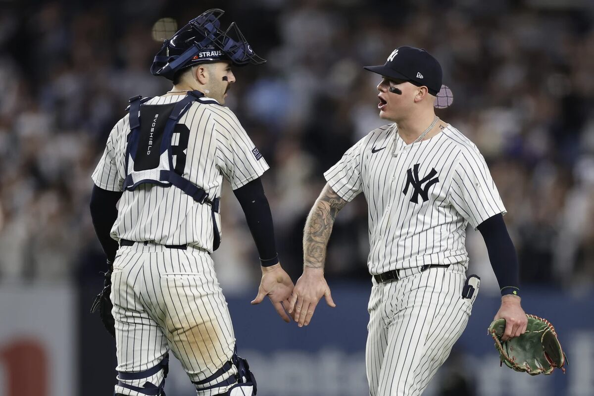 New York Yankees catcher Austin Wells (28) and outfielder Alex Verdugo celebrate after defeating the Kansas City Royals in Game 1 of the American League baseball division series, Saturday, Oct. 5, 2024, in New York.