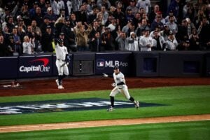 Yankees' Austin Wells reacts to Anthony Volpe's grand slam in the Yankees 11-4 win over the Dodgers at Yankee Stadium on Oct 29, 2024.