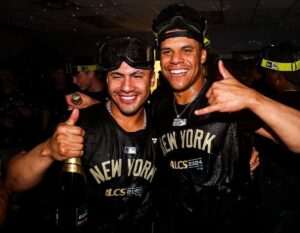 Gleyber Torres and Juan Soto celebrate as the New York Yankees advance into the ALCS after defeating the Royals at Kauffman Stadium on October 10, 2024.