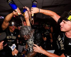 Yankees flood Jazz Chisholm Jr. with boos and champagne after they beat the Royals to advance into the ALCS after defeating the Royals at Kauffman Stadium on October 10, 2024.