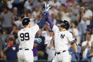 The Yankees’ Aaron Judge (99) celebrates with Giancarlo Stanton after hitting a home run against the Dodgers on June 9.