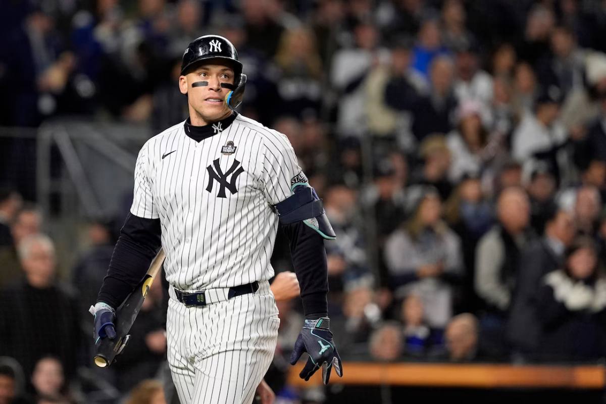 New York Yankees' Aaron Judge walks back to the dugout after striking out against the Los Angeles Dodgers during the first inning in Game 3 of the baseball World Series, Monday, Oct. 28, 2024, in New York.