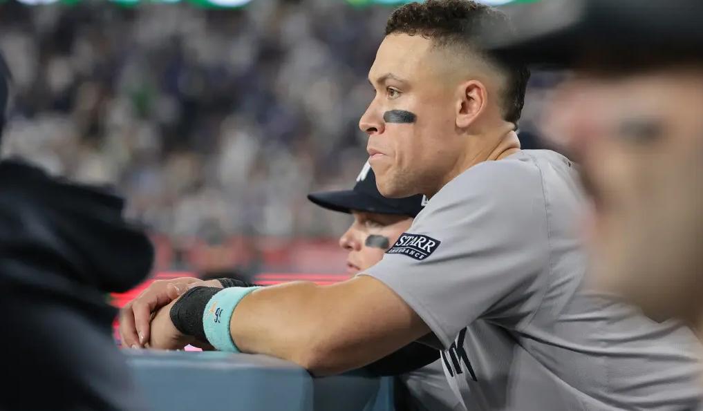 A stoic Aaron Judge watches the action from the dugout after striking out in the sixth inning in the Yankees’ Game 2 loss.