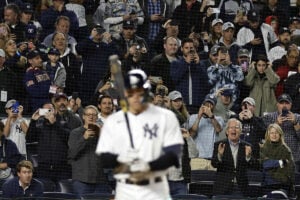 Fans watch as New York Yankees’ Aaron Judge comes to bat during the third inning of the team’s baseball game against the Baltimore Orioles on Friday, Sept. 30, 2022, in New York.