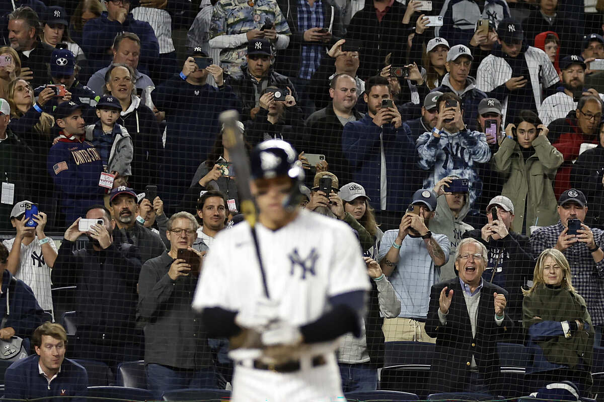 Fans watch as New York Yankees’ Aaron Judge comes to bat during the third inning of the team’s baseball game against the Baltimore Orioles on Friday, Sept. 30, 2022, in New York.