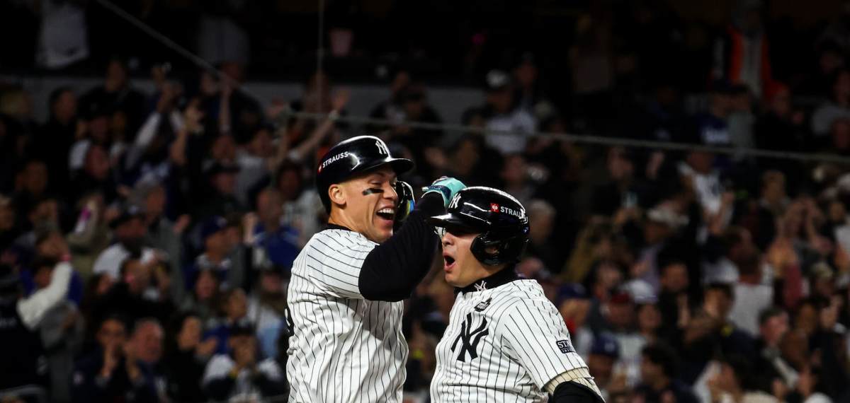 New York Yankees’ Anthony Volpe celebrates his grand slam home run with Aaron Judge against the Los Angeles Dodgers during the third inning in Game 4 of the baseball World Series, Tuesday, Oct. 29, 2024, in New York.