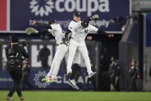 From left to right, Alex Verdugo, Aaron Judge and Juan Soto celebrate after Game 1 of the baseball AL Championship Series against the Cleveland Guardians Monday, Oct. 14, 2024, in New York. The Yankees won 5-2.