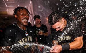 Jazz Chisholm Jr. and Anthony Volpe celebrate as the Yankees clinch their ALCS berth on October 10, 2024.