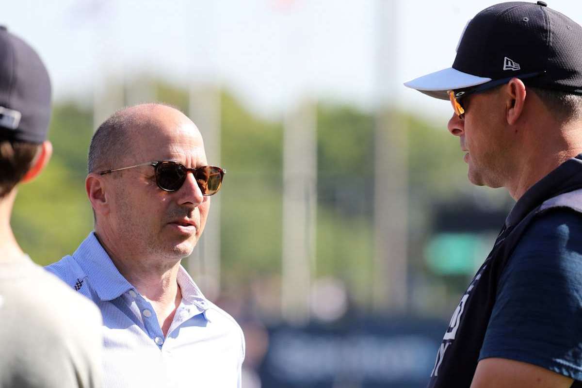 In October, 2024, Yankees general manager Brian Cashman talks to Aaron Boone, manager of the New York Yankees.