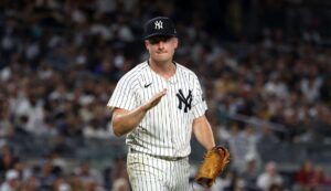 NEW YORK, NY - SEPTEMBER 13: Clarke Schmidt #36 of the New York Yankees reacts during the game against the Boston Red Sox at Yankee Stadium on September 13, 2024, in New York, New York.