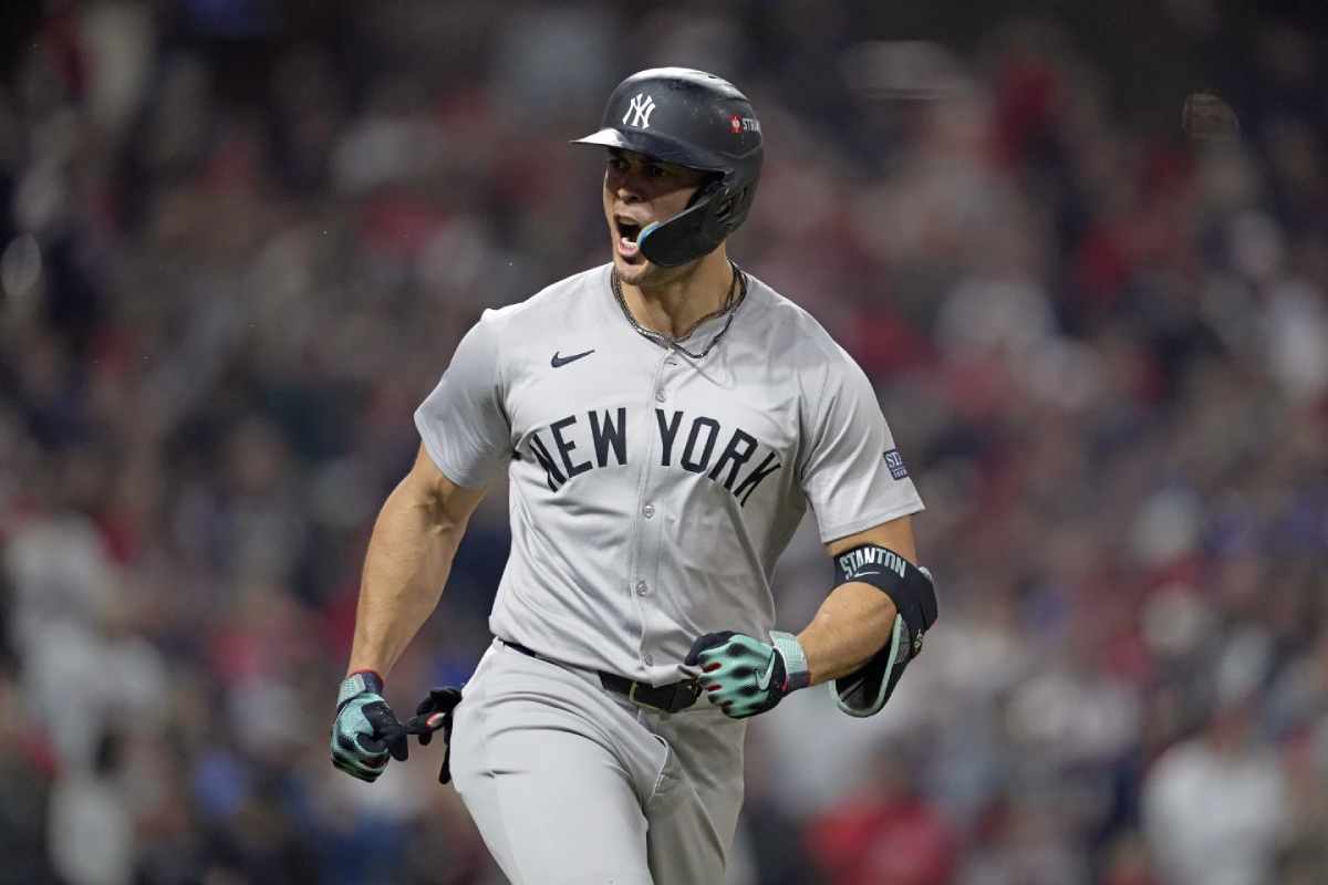 New York Yankees’ Giancarlo Stanton celebrates after hitting a three-run home run against the Cleveland Guardians during the 10th inning in Game 5 of the baseball AL Championship Series Saturday, Oct. 19, 2024, in Cleveland.