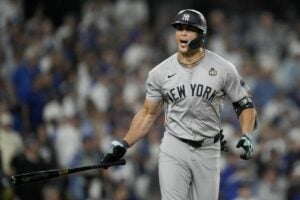 On October 25, 2024, Giancarlo Stanton watches his record-breaking home run soar for 6.54 seconds, securing a 2-1 lead for the Yankees in Game 1 of the World Series at Dodger Stadium.