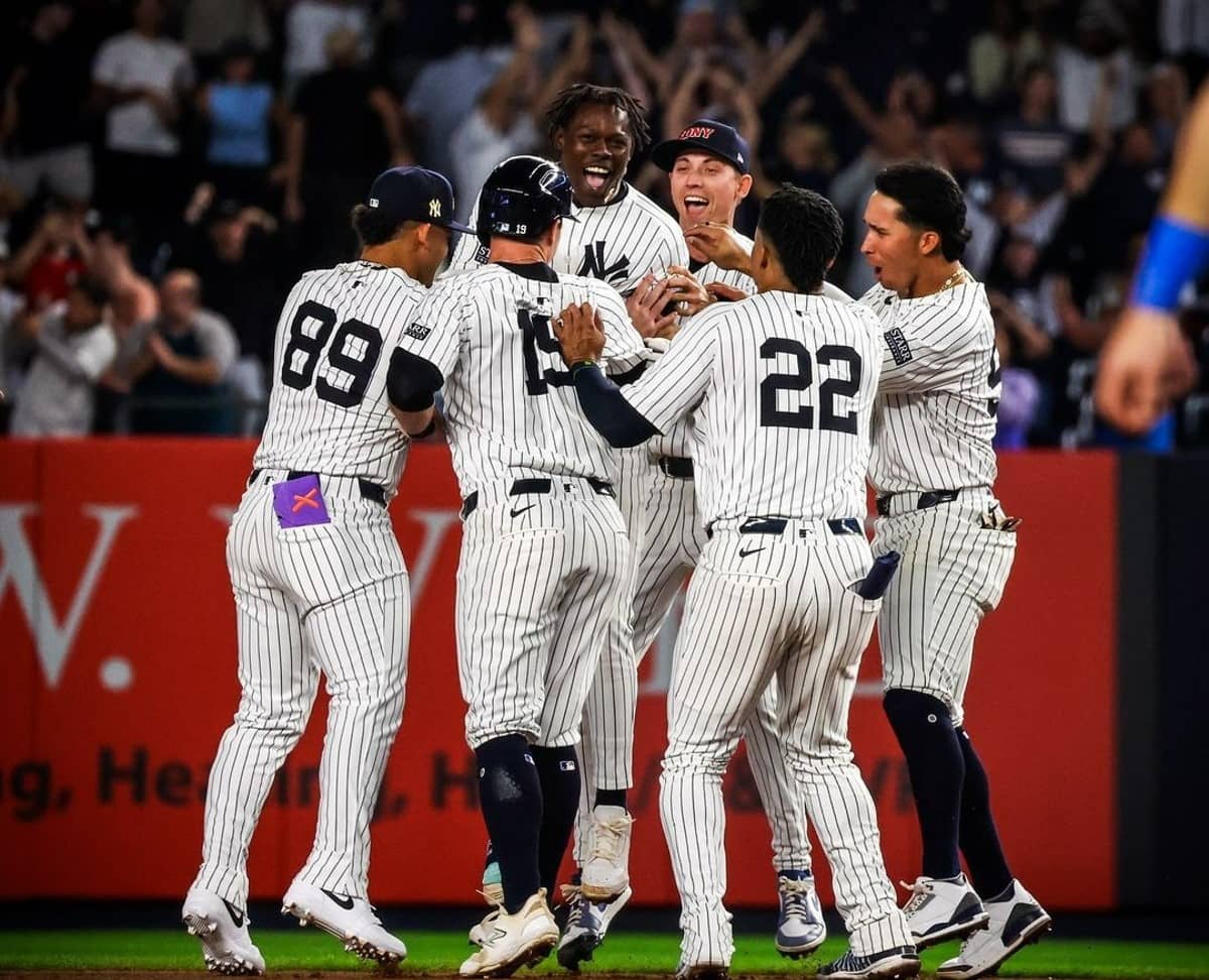 The Yankees celebrate after Jazz Chisholm's walk