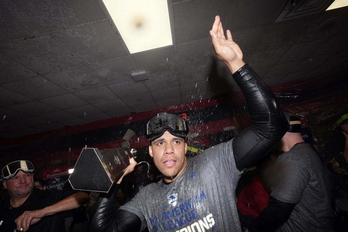 New York Yankees’ Juan Soto celebrates in the clubhouse after Game 5 of the baseball AL Championship Series against the Cleveland Guardians Sunday, Oct. 20, 2024, in Cleveland. The Yankees won 5-2 to advance to the World Series.