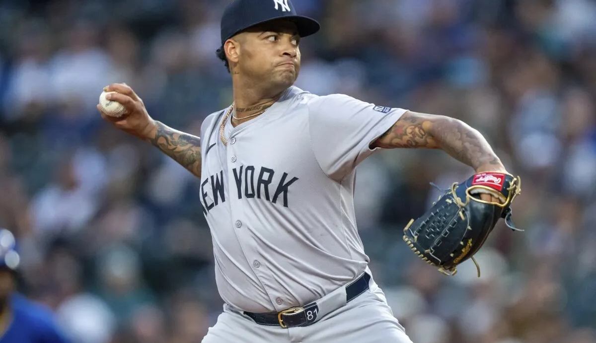 New York Yankees starter Luis Gil delivers a pitch during the first inning of a baseball game against the Seattle Mariners, Tuesday, Sept. 17, 2024, in Seattle.