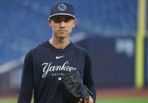 Luke Weaver, Yankees reliever, pitching during a game in October, reflecting on his journey from a waiver claim to becoming the team's closer for the postseason