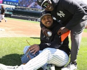 Yankees pitcher Nestor Cortes is with team's fitness trainer Larry Adegoke at Yankee Stadium, Oct 1, 2024.