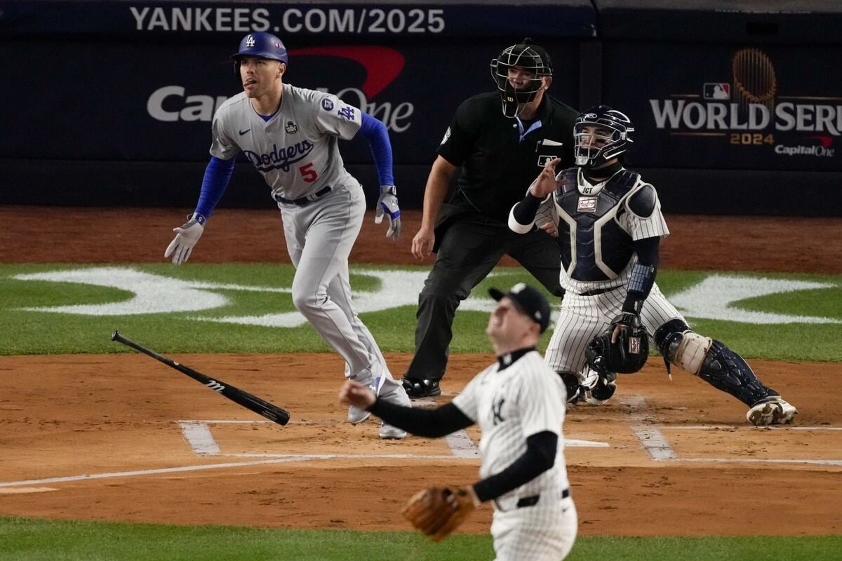 Los Angeles Dodgers’ Freddie Freeman hits a two-run home run against the New York Yankees during the first inning in Game 3 of the baseball World Series, Monday, Oct. 28, 2024, in New York.