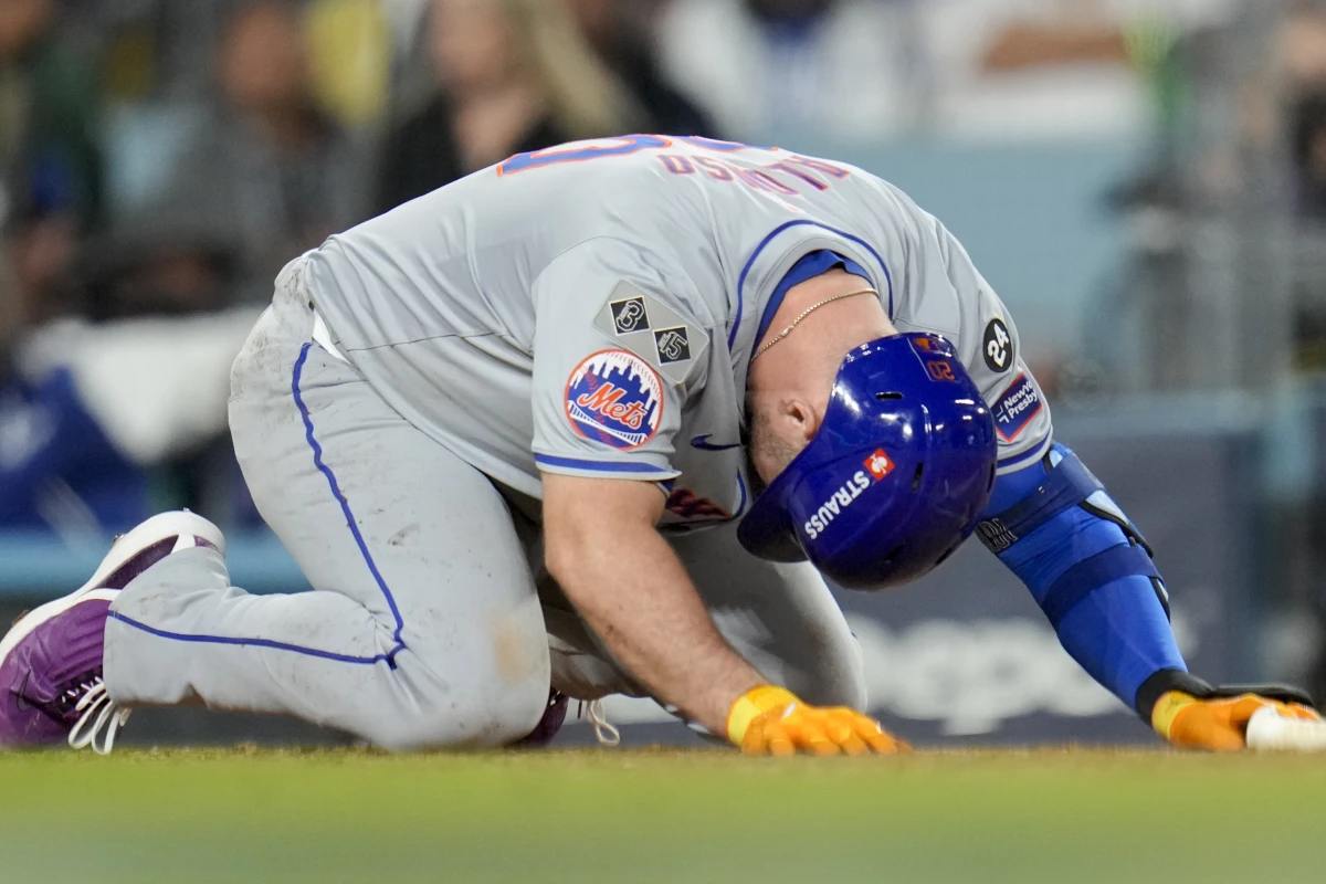 Mets' Pete Alonso reacts after getting hit by a foul ball against the Dodgers on October 20, 2024, in Los Angeles. The Dodgers will meet the Yankees in the 2024 World Series.