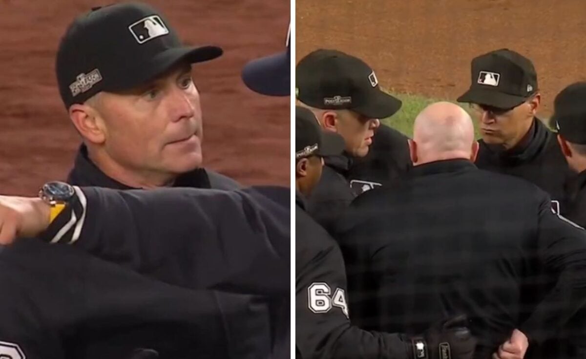 Umpire Mike Estabrook is seen in a discussion with Aaron Boone and the Yankees' staff during a controversial moment in the seventh inning of the ALCS opener, where the Yankees secured a 5-2 victory over the Guardians on October 14, 2024.