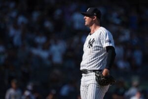 data-c-caption="Aug 11, 2024; Bronx, New York, USA; New York Yankees relief pitcher Clay Holmes (35) reacts after a pitch during the ninth inning against the Texas Rangers at Yankee Stadium.