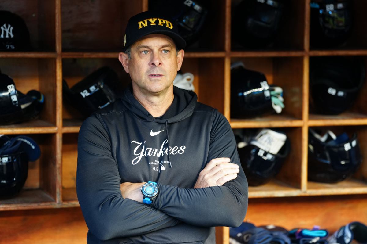 NEW YORK, NY - SEPTEMBER 11: Manager Aaron Boone #17 of the New York Yankees looks on from the dugout prior to the game between the Kansas City Royals and the New York Yankees at Yankee Stadium on Wednesday, September 11, 2024 in New York, New York