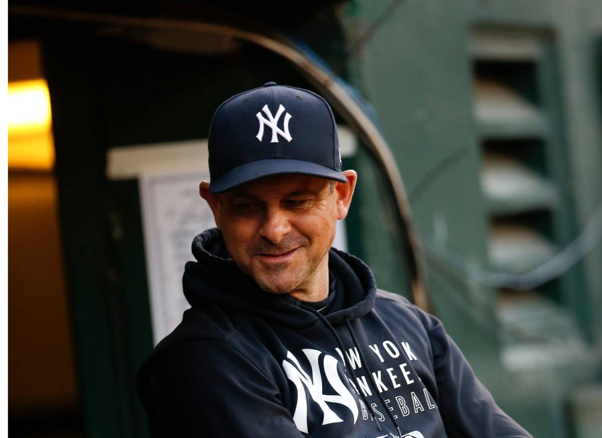 NEW YORK, NY - SEPTEMBER 11: Manager Aaron Boone #17 of the New York Yankees looks on from the dugout prior to the game between the Kansas City Royals and the New York Yankees at Yankee Stadium on Wednesday, September 11, 2024 in New York, New York