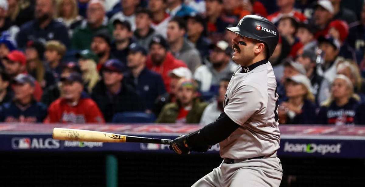 Yankees' Austin Wells hitting a home run against the Guardians in Game 4 of the ALCS on October 18, 2024.