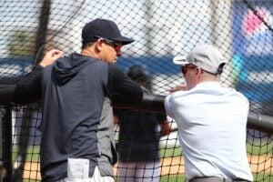 Feb 18, 2020; Tampa, Florida, USA; New York Yankees manager Aarnon Boone (17) talks with general manager Brain Cashman during spring training at George M. Steinbrenner Field.