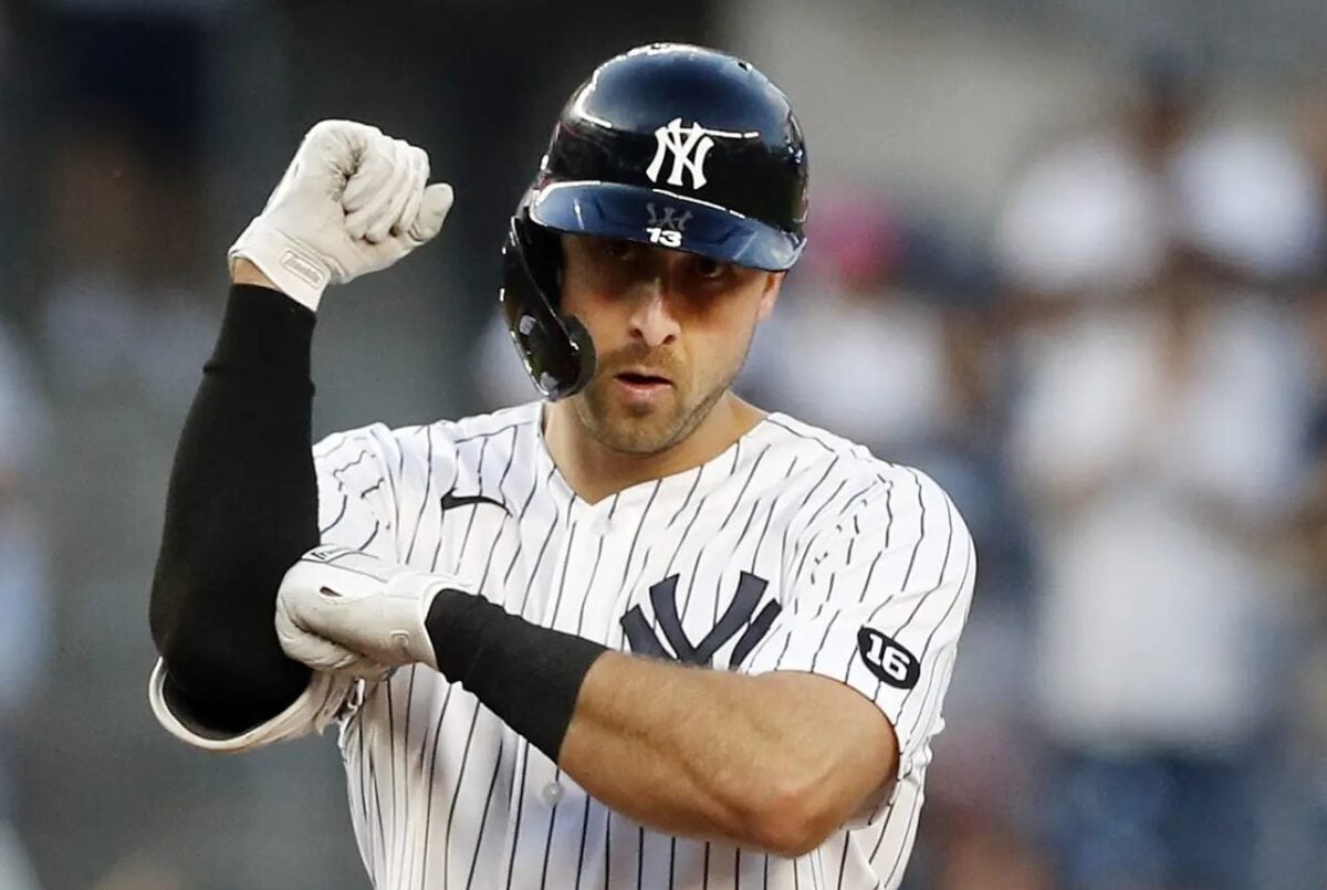 Joey Gallo, outfielder for the Yankees in 2022, preparing to bat during a game, wearing the Yankees' iconic pinstripe uniform.