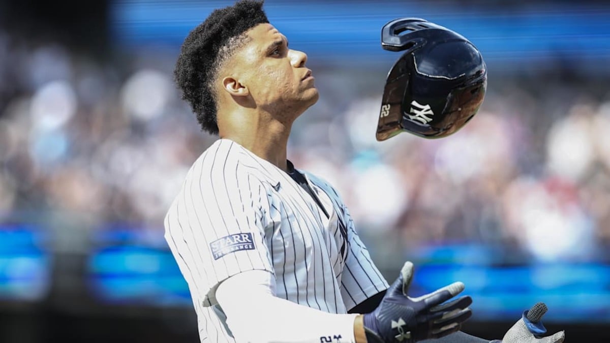 Sep 1, 2024; Bronx, New York, USA; New York Yankees right fielder Juan Soto (22) tosses his helmet after flying out to end the sixth inning against the St. Louis Cardinals at Yankee Stadium.