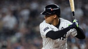 Sep 1, 2024; Bronx, New York, USA; New York Yankees right fielder Juan Soto (22) tosses his helmet after flying out to end the sixth inning against the St. Louis Cardinals at Yankee Stadium.