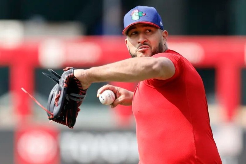 Carlos Estévez, a hard-throwing reliever, pitches during the Philadelphia Phillies' 2024 training session. As of November 8, 2024, reports indicate that the New York Yankees are interested in acquiring Estévez to bolster their bullpen