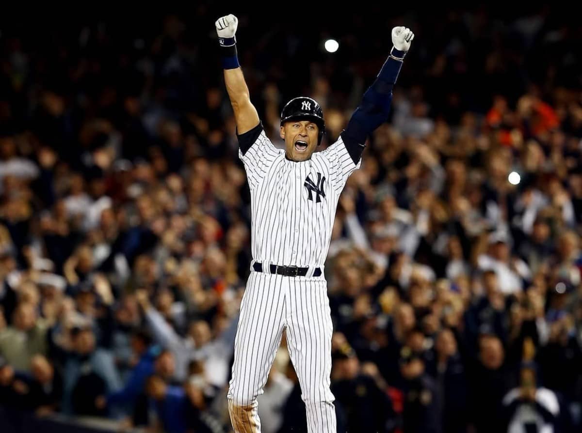 Derek Jeter celebrates after ensuring the Yankees a win with walk-off single against the Baltimore Orioles in the ninth inning at Yankee Stadium on Sep 25, 2014.
