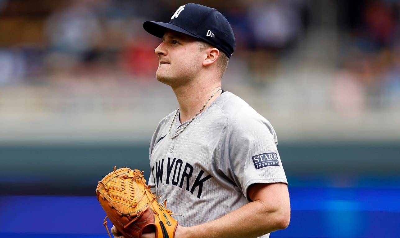 Clarke Schmidt, Yankees starting pitcher, delivering a pitch during a 2024 game, showcasing his mechanics and focus on the mound.