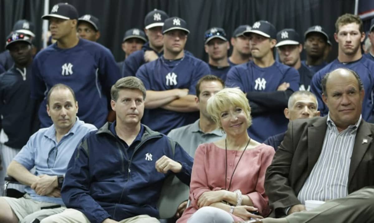 Yankees AGM Jean Afterman is seen alongside GM Brian Cashman and owner Hal Steinbrenner in