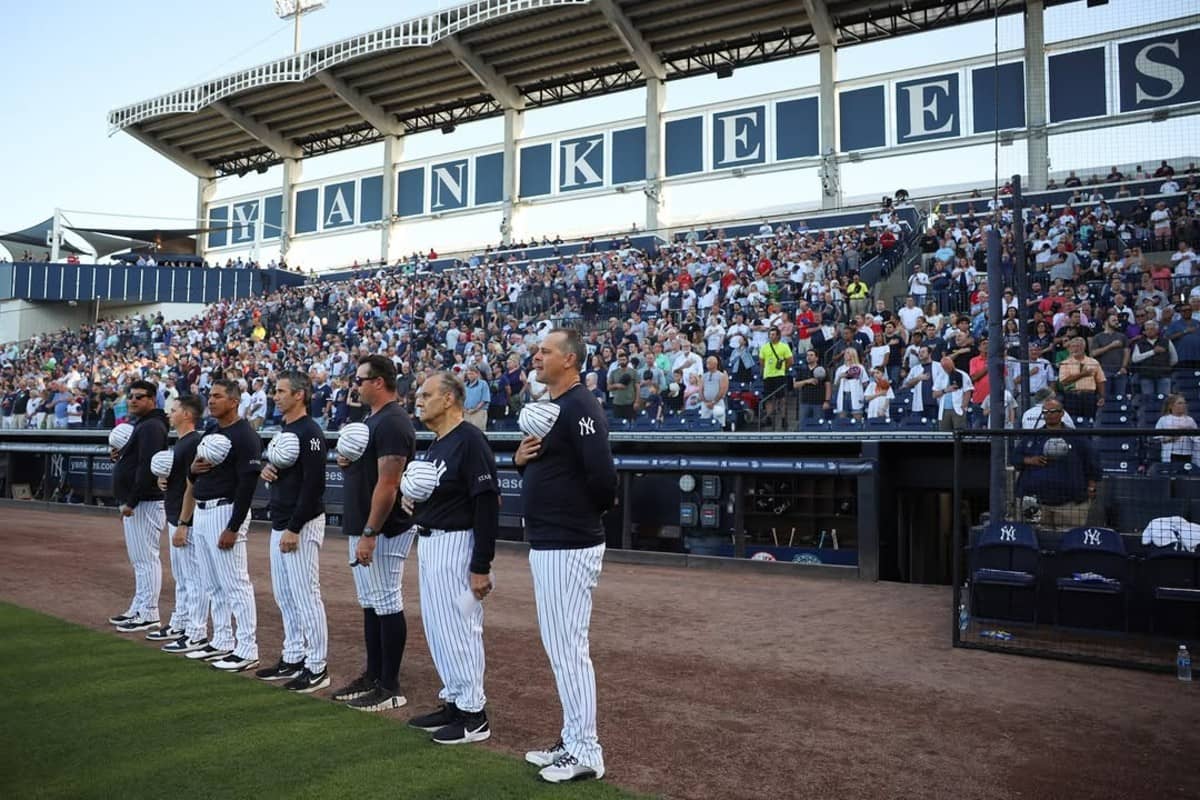 Yankees' manager Aaron Boone and his staff with ex-manager Joe Torre at George M. Steinbrenner Field on March 14, 2025.