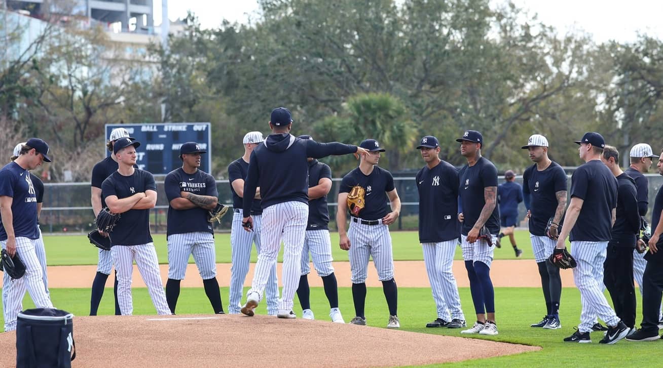 Yankees' pitching coach Matt Blake talks to his wards at