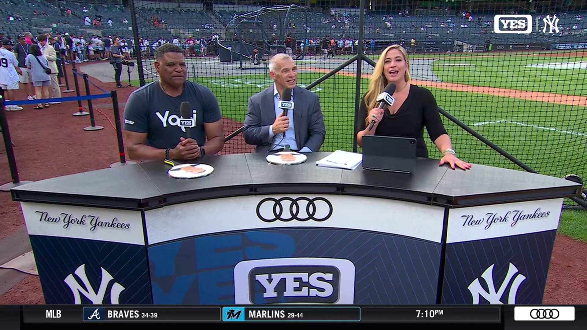 Joe Girardi talks to Meredith Marakovits of YES Network alongside Mike Harkey before the Yankees' game against the Orioles in New York on June 20, 2025.