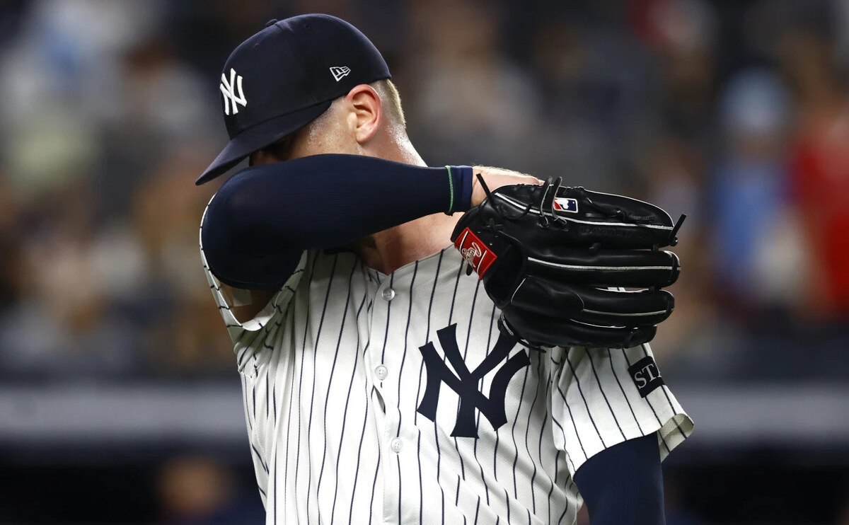 New York Yankees pitcher Ian Hamilton reacts on his way to the dugout during the ninth inning of a baseball game against the Boston Red Sox, Saturday, June 7, 2025, in New York.