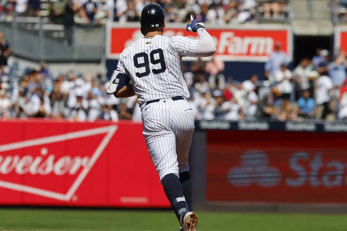 New York Yankees’ Aaron Judge (99) runs the bases after hitting a home run during the third inning of a baseball game against the Washington Nationals, Wednesday, Aug. 27, 2025, in New York.